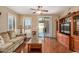 Bright living room with hardwood floors and sliding glass door at 1306 E Cecil Ct, Casa Grande, AZ 85122