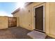 Side yard with security gate and gravel landscaping at 1306 E Cecil Ct, Casa Grande, AZ 85122