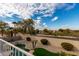 Landscaped backyard with pool and golf course views at 13332 W Palo Verde Dr, Litchfield Park, AZ 85340