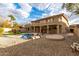 Large backyard featuring a kidney-shaped pool and gravel landscaping at 13332 W Palo Verde Dr, Litchfield Park, AZ 85340