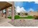 Landscaped backyard with pool and artificial turf at 13332 W Palo Verde Dr, Litchfield Park, AZ 85340