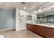 Elegant bathroom with a double vanity and large soaking tub at 13332 W Palo Verde Dr, Litchfield Park, AZ 85340