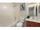 Clean bathroom with tub, toilet and vanity at 13332 W Palo Verde Dr, Litchfield Park, AZ 85340