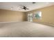 Bright bedroom featuring a sliding door to balcony access at 13332 W Palo Verde Dr, Litchfield Park, AZ 85340