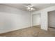 Bedroom with mirrored closet and ceiling fan at 13332 W Palo Verde Dr, Litchfield Park, AZ 85340