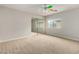 Bedroom with mirrored closet and ceiling fan at 13332 W Palo Verde Dr, Litchfield Park, AZ 85340