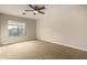 Well-lit bedroom with neutral walls and plush carpeting at 13332 W Palo Verde Dr, Litchfield Park, AZ 85340