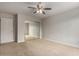 Bright bedroom with mirrored closet and ceiling fan at 13332 W Palo Verde Dr, Litchfield Park, AZ 85340