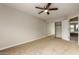 Bright bedroom with ceiling fan and mirrored closet at 13332 W Palo Verde Dr, Litchfield Park, AZ 85340