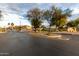 Gated community entrance with landscaping and signage at 13332 W Palo Verde Dr, Litchfield Park, AZ 85340