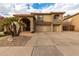 Two-story home with three-car garage and desert landscaping at 13332 W Palo Verde Dr, Litchfield Park, AZ 85340