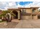 Two-story home with three-car garage and desert landscaping at 13332 W Palo Verde Dr, Litchfield Park, AZ 85340