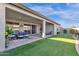 Artificial turf backyard with covered patio and seating at 1520 W Sonoqui Blvd, San Tan Valley, AZ 85140