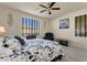 Bright bedroom with a comfortable bed and relaxing sitting area at 1520 W Sonoqui Blvd, San Tan Valley, AZ 85140