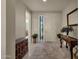 Bright and airy foyer with tile flooring and a console table at 1520 W Sonoqui Blvd, San Tan Valley, AZ 85140