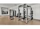 Fitness center with strength training equipment, including a power rack and dumbbells at 1520 W Sonoqui Blvd, San Tan Valley, AZ 85140