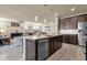 Modern kitchen with granite countertops and stainless steel appliances at 1520 W Sonoqui Blvd, San Tan Valley, AZ 85140