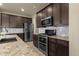 Modern kitchen with stainless steel appliances and granite counters at 1520 W Sonoqui Blvd, San Tan Valley, AZ 85140