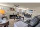 Spacious living room featuring a cozy seating area and adjacent dining space at 1520 W Sonoqui Blvd, San Tan Valley, AZ 85140