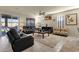 Relaxing living room with reclining sofas and a large area rug at 1520 W Sonoqui Blvd, San Tan Valley, AZ 85140