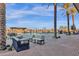 Resort-style pool with lounge chairs and palm trees at 1520 W Sonoqui Blvd, San Tan Valley, AZ 85140