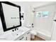 Updated bathroom, featuring a white subway tile shower and bathtub at 1539 E 3Rd St, Mesa, AZ 85203