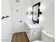 Modern bathroom with white vanity, quartz countertop, and black fixtures at 1539 E 3Rd St, Mesa, AZ 85203