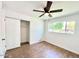 Spacious bedroom with wood-look flooring and large window at 1539 E 3Rd St, Mesa, AZ 85203