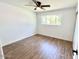 Well-lit bedroom featuring wood-look flooring and a ceiling fan at 1539 E 3Rd St, Mesa, AZ 85203