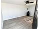 Bonus room with wood-look floors and ceiling fan at 1539 E 3Rd St, Mesa, AZ 85203