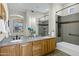 Modern bathroom with double vanity, granite countertop, and bathtub at 15522 E Cactus Dr, Fountain Hills, AZ 85268