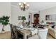 Elegant dining room with a rustic table and chandelier at 15522 E Cactus Dr, Fountain Hills, AZ 85268