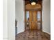 Inviting entryway with a wooden door and tiled floors at 15522 E Cactus Dr, Fountain Hills, AZ 85268