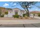 Single story home with desert landscaping and a large tree at 15522 E Cactus Dr, Fountain Hills, AZ 85268