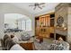 Gathering room with a fireplace and view into the dining area at 15522 E Cactus Dr, Fountain Hills, AZ 85268