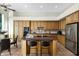 Kitchen features granite island, stainless steel appliances, and wood cabinetry at 15522 E Cactus Dr, Fountain Hills, AZ 85268