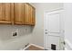 Laundry room with cabinets and pet door at 15522 E Cactus Dr, Fountain Hills, AZ 85268