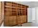 Large built-in wooden bookcase with drawers and ladder at 15522 E Cactus Dr, Fountain Hills, AZ 85268