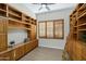 Built-in wooden shelves and ladder in a bright library at 15522 E Cactus Dr, Fountain Hills, AZ 85268