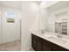 Bathroom features a double vanity, tile floors, and a shower room at 16029 W Desert Hollow Dr, Surprise, AZ 85387