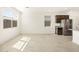 Modern kitchen area with stainless steel appliances and large windows at 16029 W Desert Hollow Dr, Surprise, AZ 85387