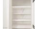 White pantry shelves, perfect for organized kitchen storage at 16029 W Desert Hollow Dr, Surprise, AZ 85387