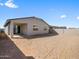 Large backyard with block wall and covered patio. Ready for landscaping at 16074 W Prickly Pear Trl, Surprise, AZ 85387