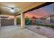 Covered patio overlooking a playset and trampoline at 17152 W Grant St, Goodyear, AZ 85338