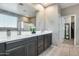 Double vanity bathroom with a walk-in shower and separate toilet area at 17152 W Grant St, Goodyear, AZ 85338