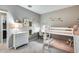 Charming bunk bed bedroom with a desk and built-in shelving at 17152 W Grant St, Goodyear, AZ 85338