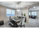 Bright dining room featuring a wooden table and chandelier at 17152 W Grant St, Goodyear, AZ 85338