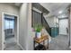 Spacious entryway with console table and staircase at 17152 W Grant St, Goodyear, AZ 85338