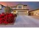 Two-story house with a large driveway and landscaping at 17152 W Grant St, Goodyear, AZ 85338