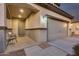 Covered entryway with a gray door and garage at 17152 W Grant St, Goodyear, AZ 85338